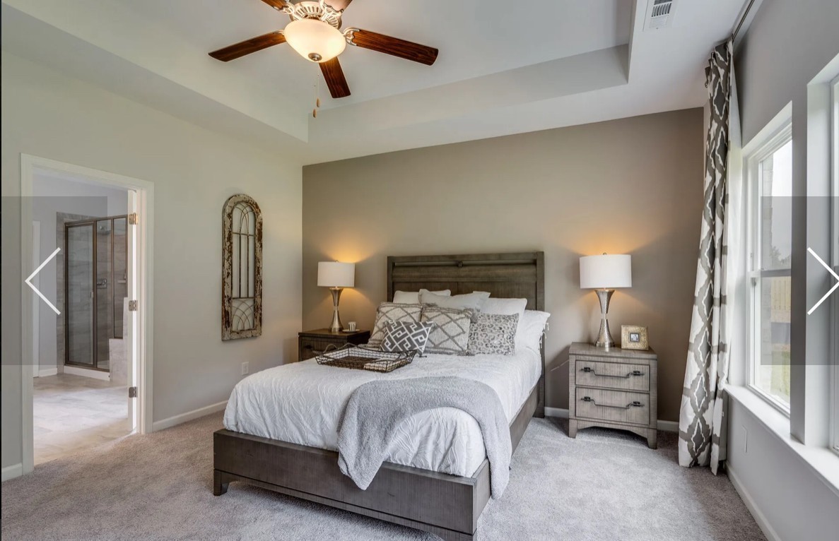 6161 Worthington Road Columbia, TN 38401 - Photo 20 of 33 a bedroom with a bed and a chandelier