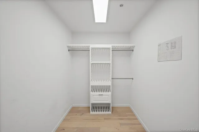 a view of a room with a white walls