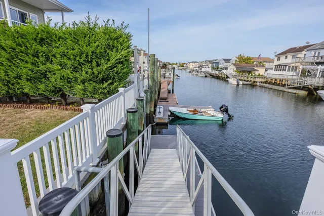a view of a house with pool and outdoor seating