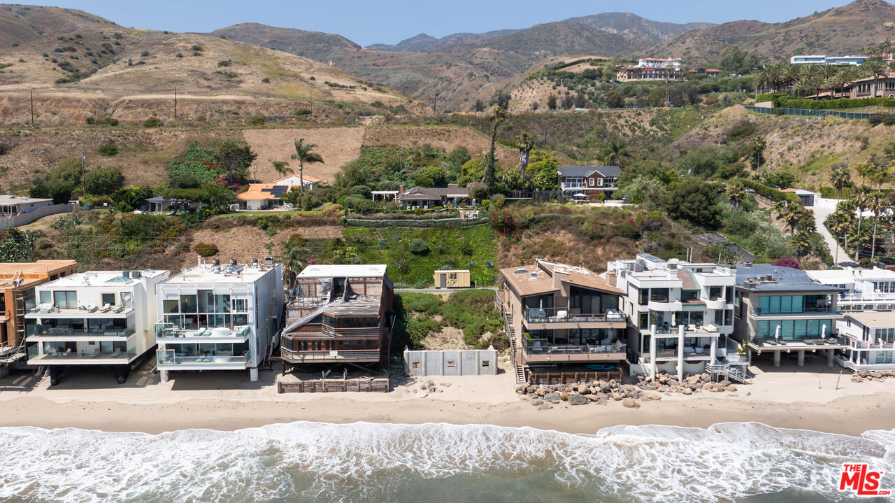 25260 Malibu Road Malibu, CA 90265 - Photo 3 of 13 an aerial view of a house with a garden and lake view