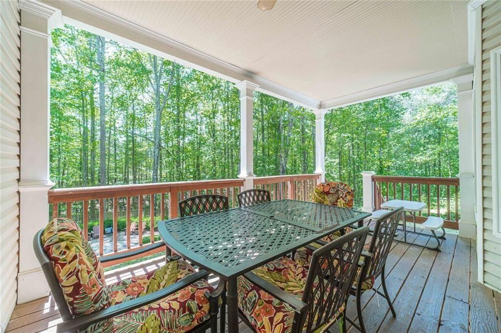395 Amberbrook Circle Grayson, GA 30017 - Photo 50 of 66 a view of a balcony with furniture and wooden floor