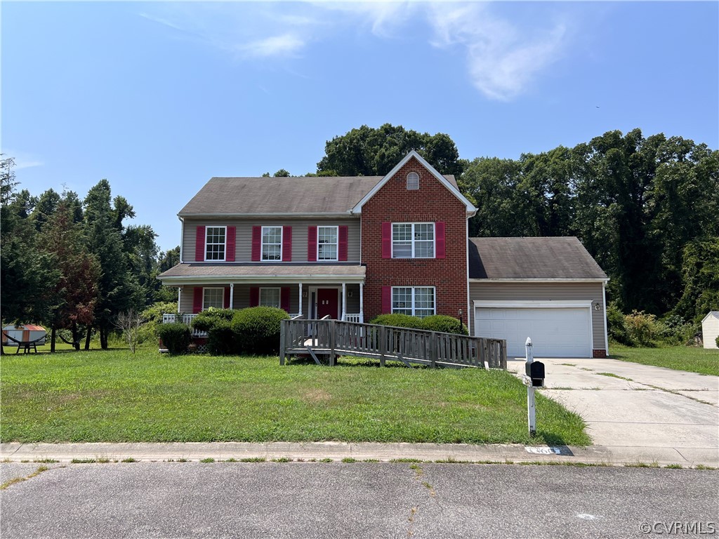 3360 Denise Road Petersburg, VA 23805 - Photo 1 of 22 a front view of a house with a yard