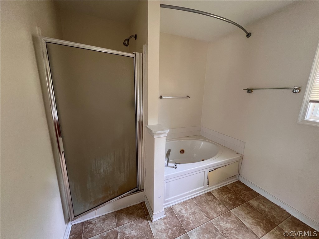 3360 Denise Road Petersburg, VA 23805 - Photo 16 of 22 a bathroom with a tub shower and toilet