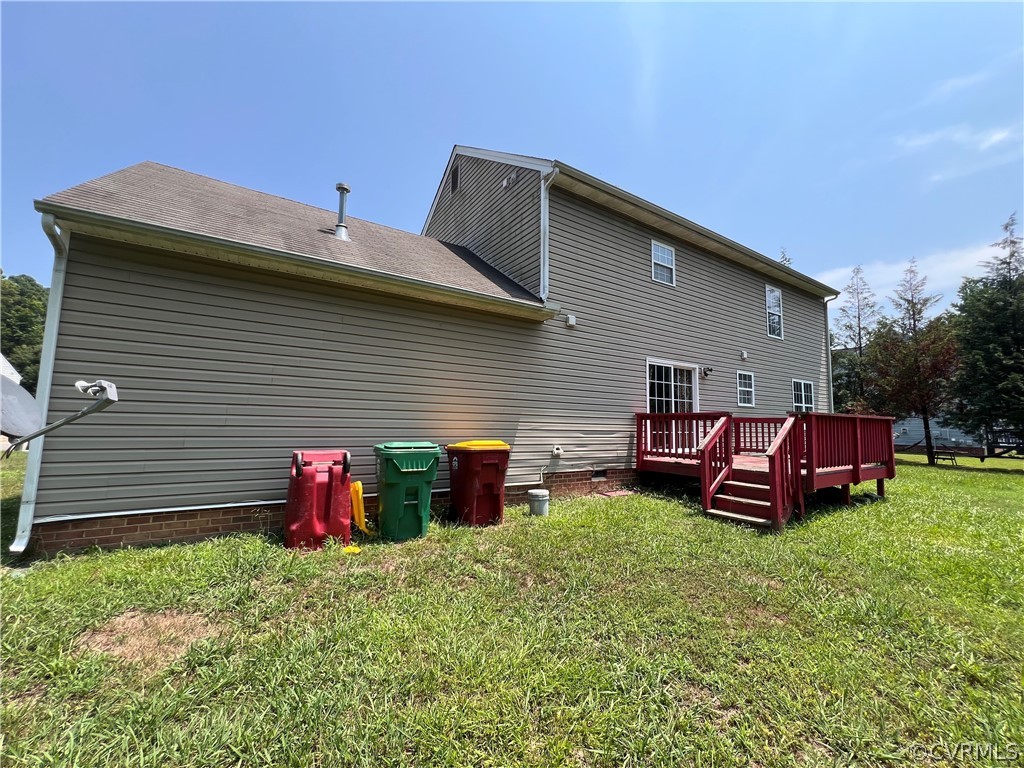 3360 Denise Road Petersburg, VA 23805 - Photo 21 of 22 a view of a backyard with table and chairs and a fire pit