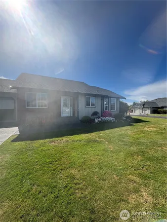 a view of a house with a yard
