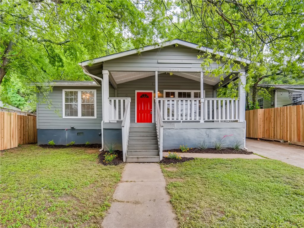 3006 Webberville Road Austin, TX 78702 - Photo 1 of 1 a front view of a house with garden