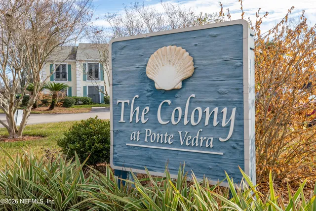 a view of outdoor space with signage and flags