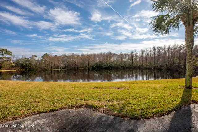 a view of a lake with a big yard