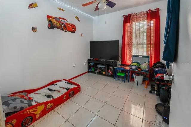 a room with toys and a flat screen tv