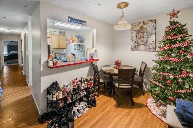 a view of a dining room with furniture and wooden floor