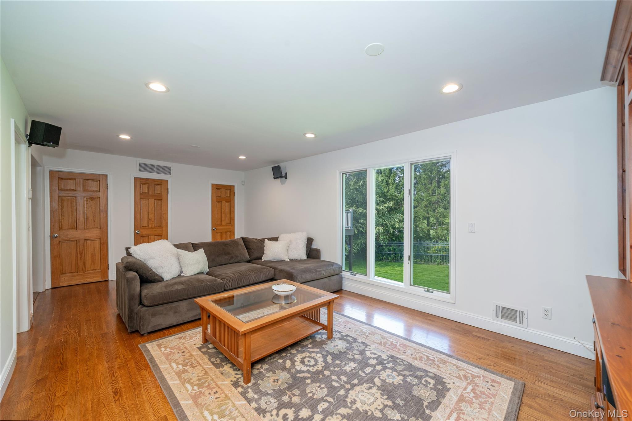 53 Tarryhill Road Tarrytown, NY 10591 - Photo 15 of 35 Another view of the family room's generous proportions and convenient access to the powder room. An adjacent closet offers potential space for expanding the powder room to a full bath, if desired.