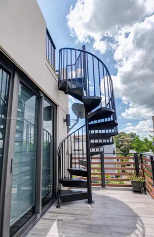 a view of entryway with wooden floor