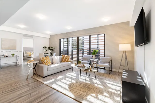 a living room with fireplace furniture and a flat screen tv