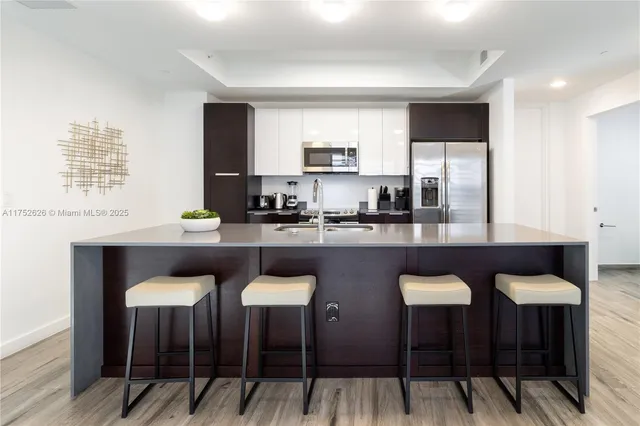 a kitchen with a sink cabinets and window