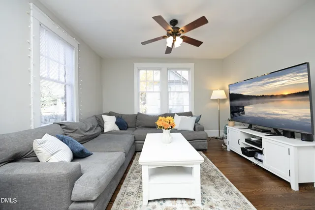 a living room with furniture and a flat screen tv
