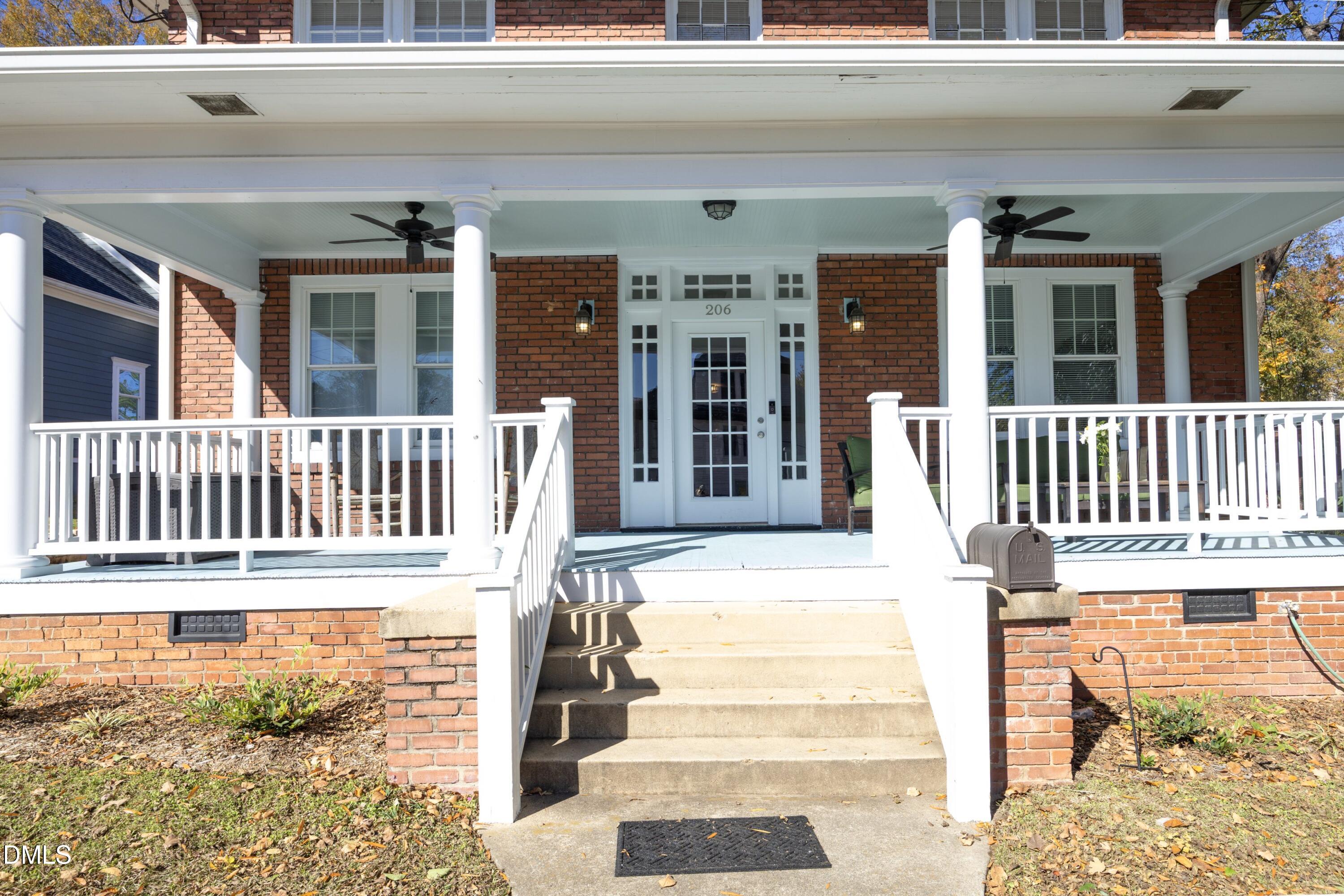 206 Ashe Avenue Raleigh, NC 27605 - Photo 2 of 37 a view of a house with a small yard and wooden floor and fence