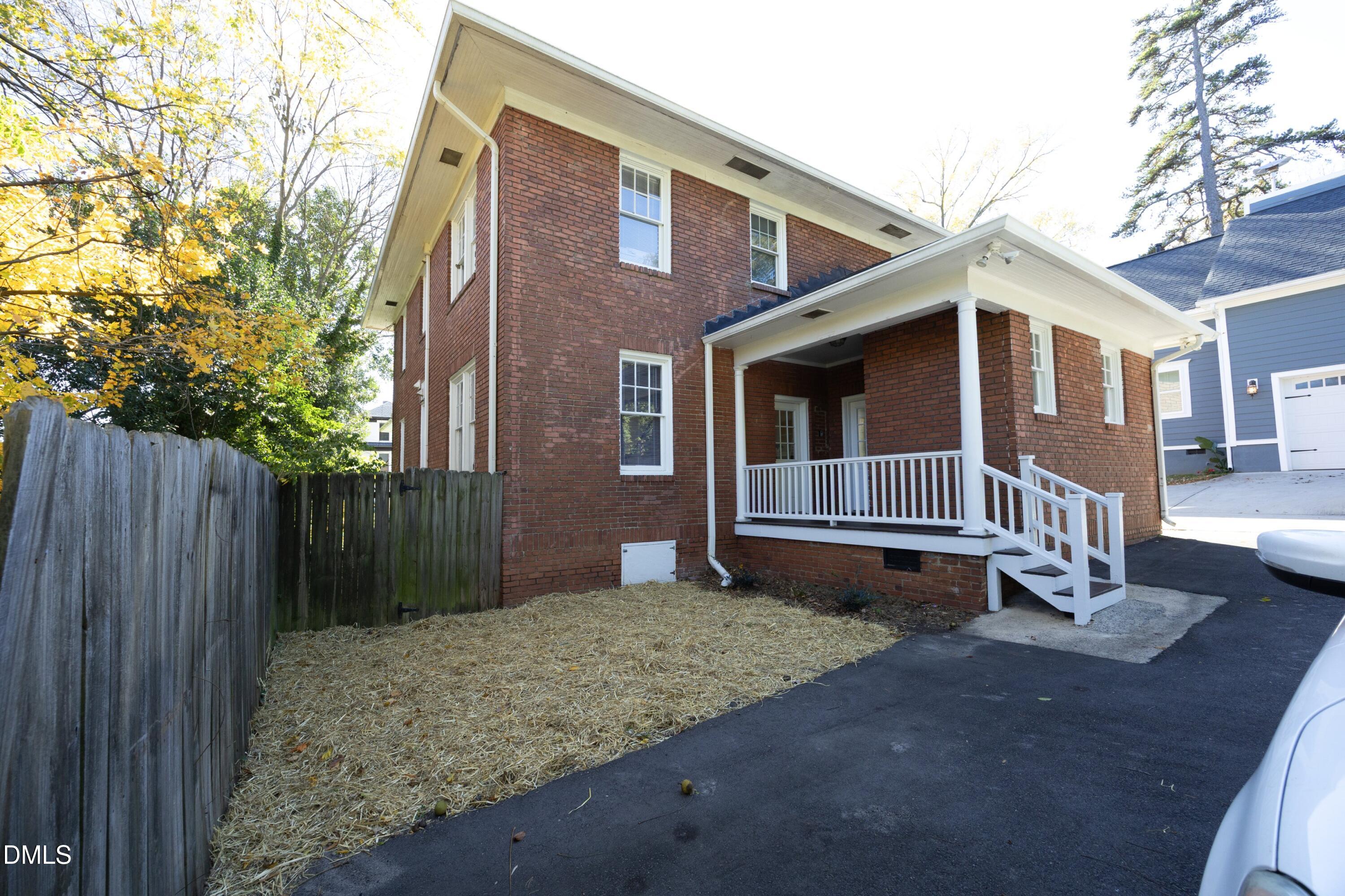 206 Ashe Avenue Raleigh, NC 27605 - Photo 32 of 37 a front view of a house with a yard