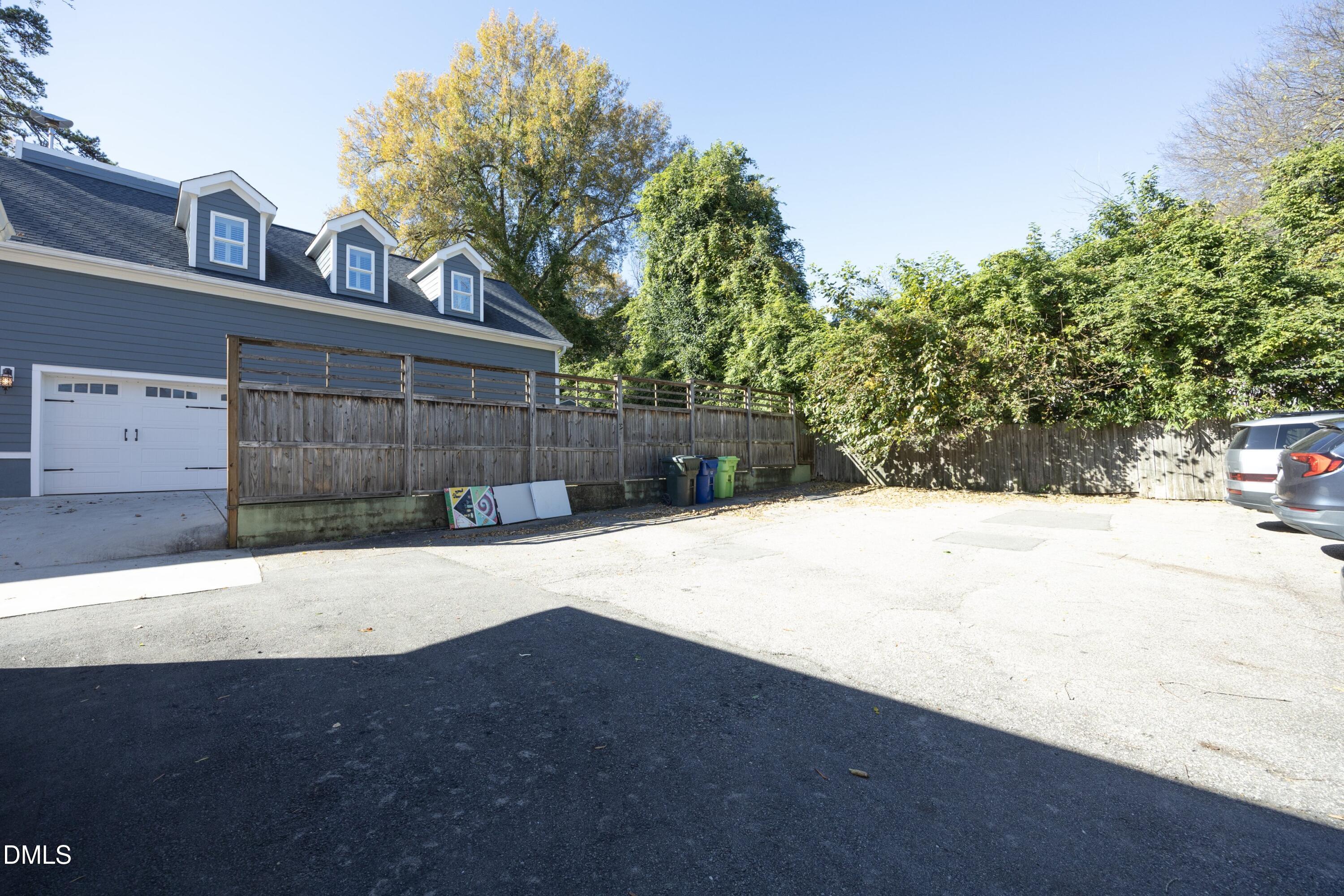 206 Ashe Avenue Raleigh, NC 27605 - Photo 33 of 37 a view of backyard with a large tree