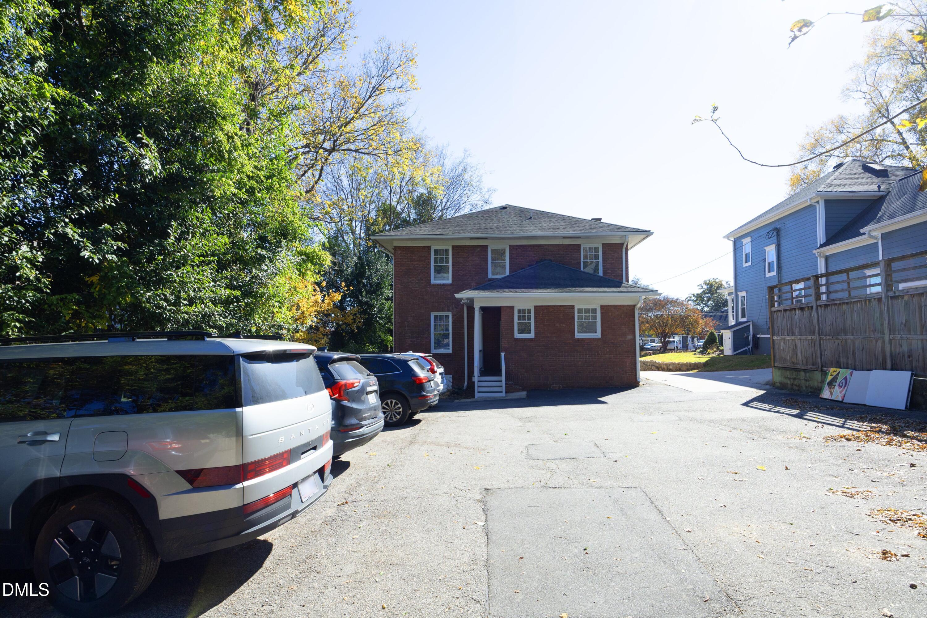 206 Ashe Avenue Raleigh, NC 27605 - Photo 34 of 37 a front view of a house with a yard