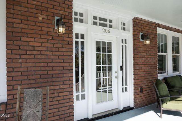 a view of front door of house with stairs