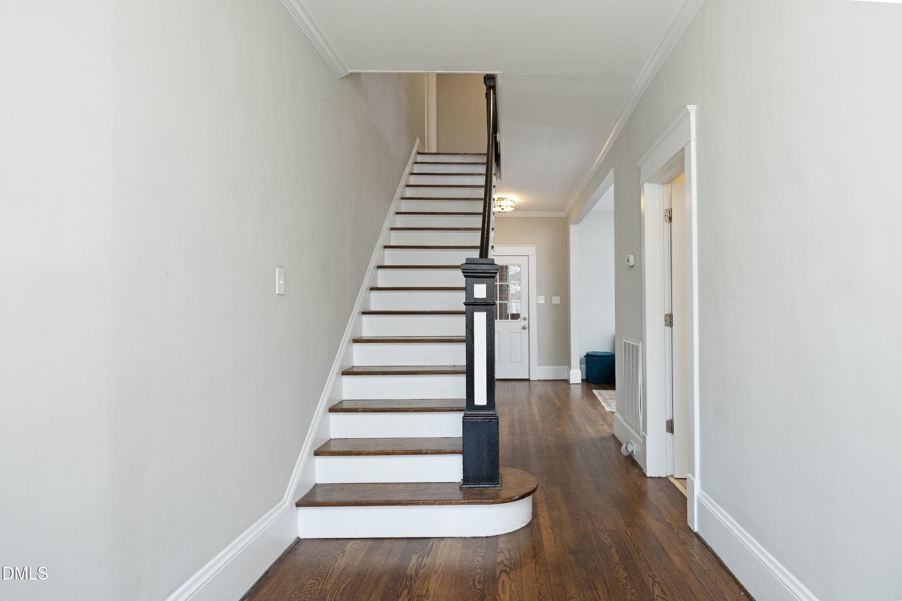 206 Ashe Avenue Raleigh, NC 27605 - Photo 6 of 37 a view of entryway with wooden floor