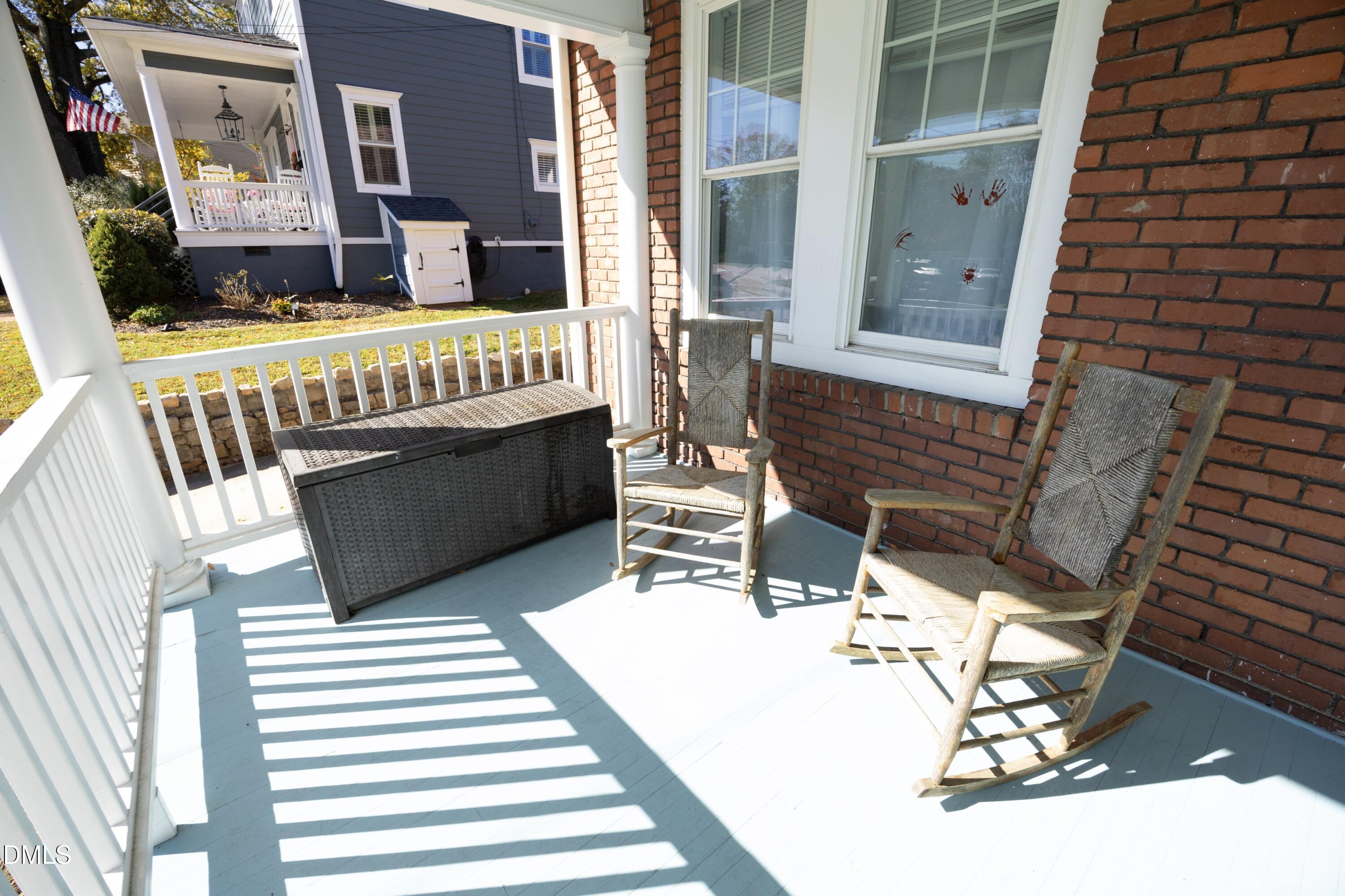 206 Ashe Avenue Raleigh, NC 27605 - Photo 10 of 37 a balcony with table and chairs
