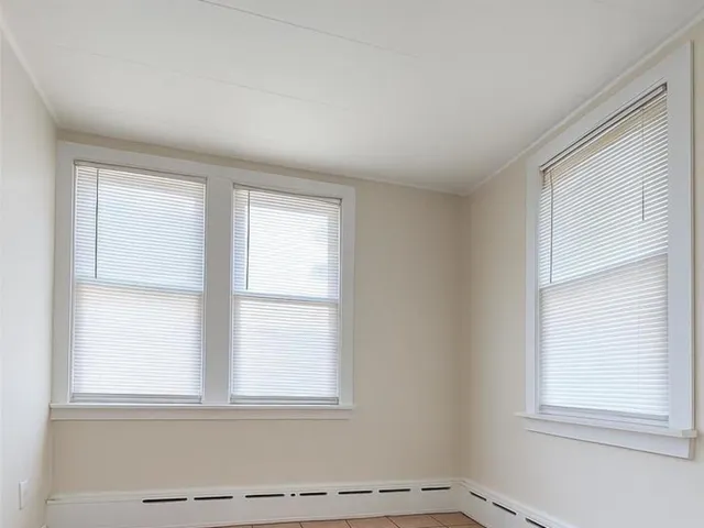 an empty room with window