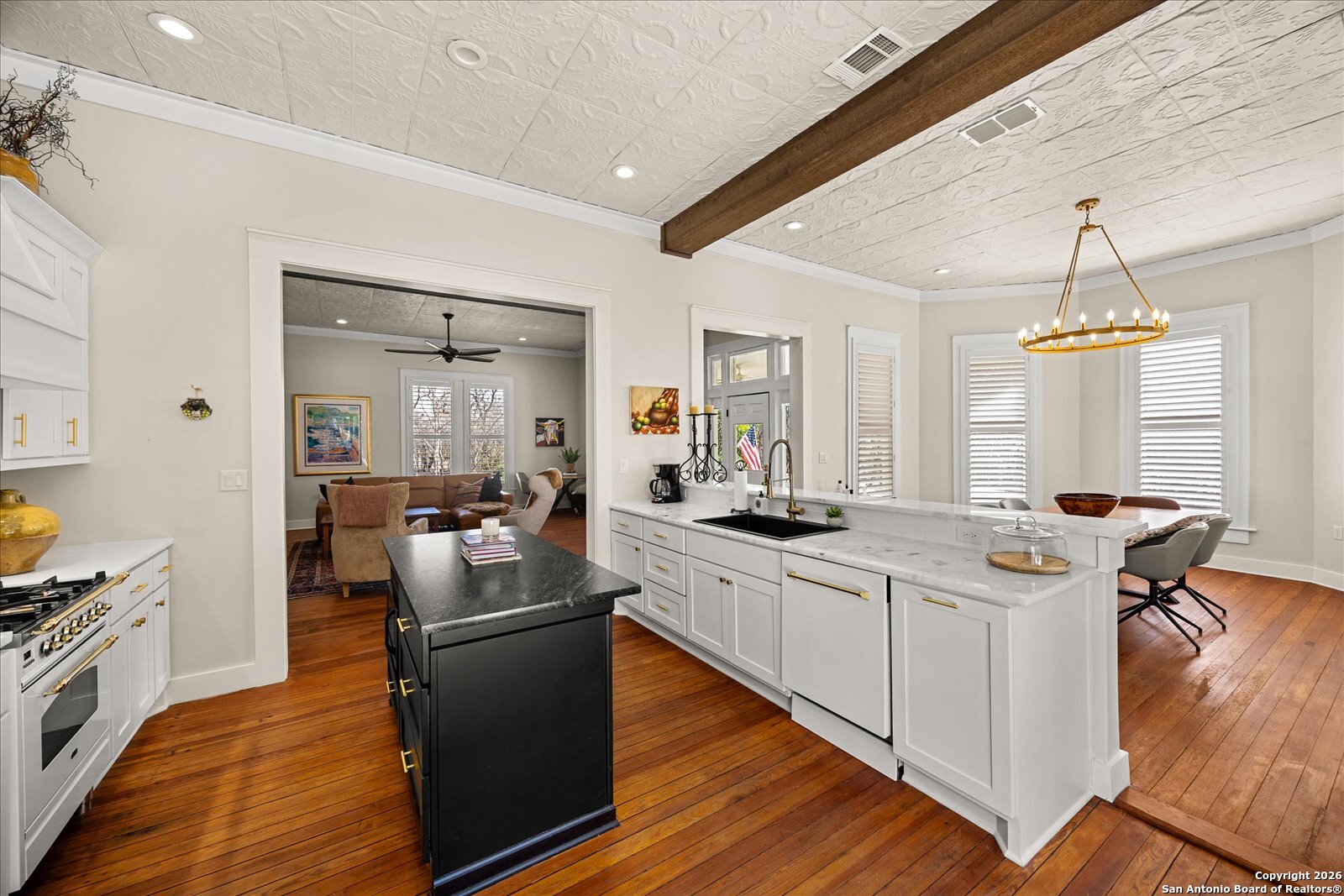 1006 High Street Comfort, TX 78013 - Photo 18 of 50 a kitchen with stainless steel appliances granite countertop a sink stove and refrigerator