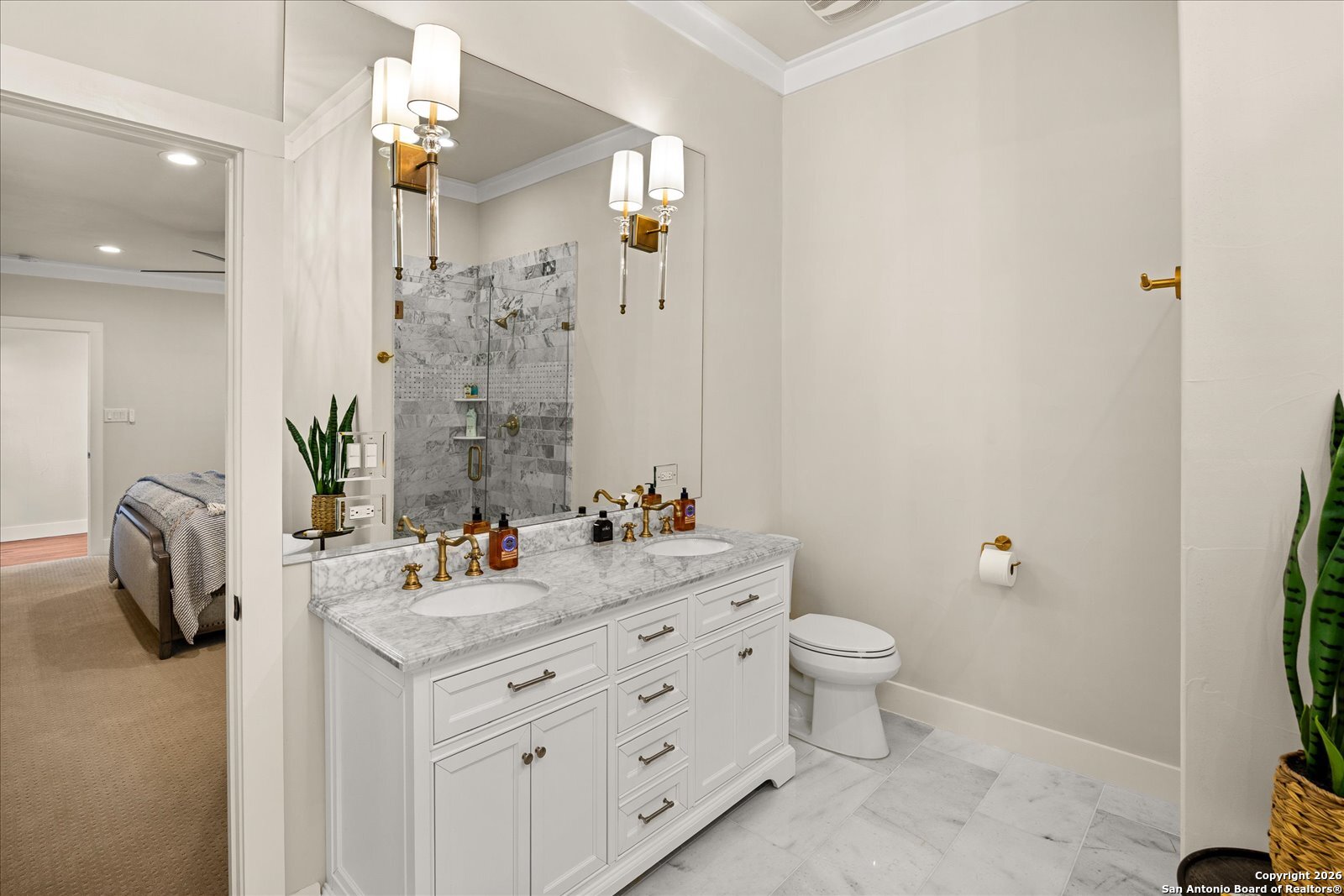 1006 High Street Comfort, TX 78013 - Photo 24 of 50 a bathroom with a double vanity sink toilet and a mirror