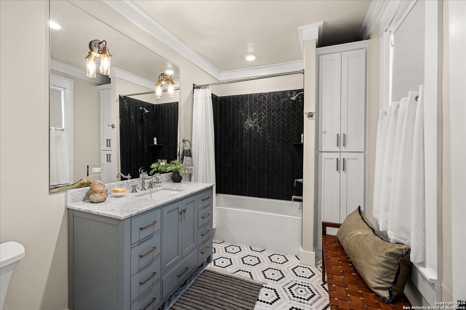 1006 High Street Comfort, TX 78013 - Photo 31 of 50 a bathroom with a sink a toilet and shower