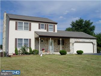 142 West Wolfert Station Road Mickleton, NJ 08056 - Photo 1 of 12 a front view of a house with a yard and garage