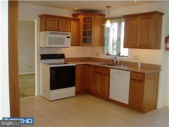 142 West Wolfert Station Road Mickleton, NJ 08056 - Photo 6 of 12 a kitchen with a sink stove and cabinets
