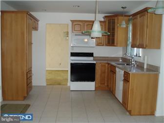 142 West Wolfert Station Road Mickleton, NJ 08056 - Photo 7 of 12 a kitchen with stainless steel appliances granite countertop a stove a sink and a refrigerator