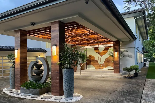 a front view of a house with garden