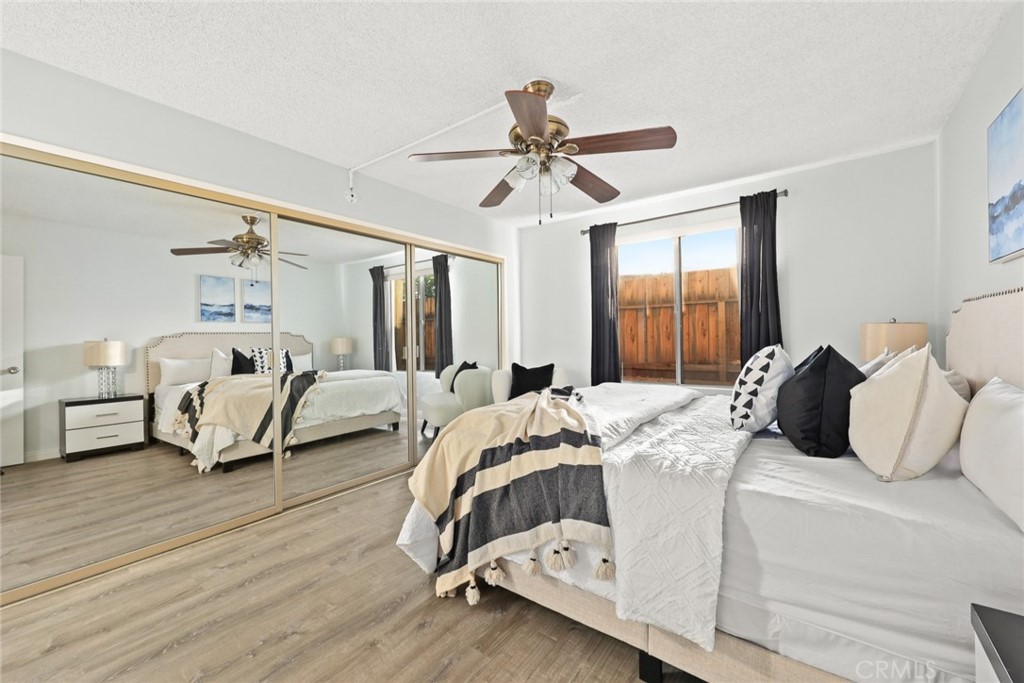 540 Fairview Avenue, Unit 27 Arcadia, CA 91007 - Photo 18 of 40 a bedroom with a bed and a chandelier