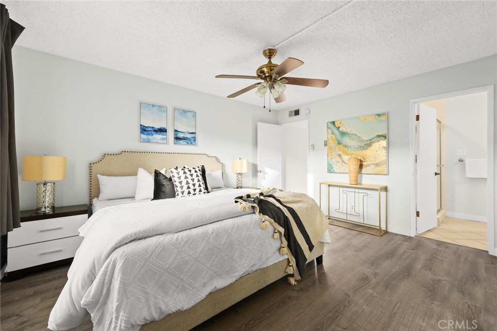 540 Fairview Avenue, Unit 27 Arcadia, CA 91007 - Photo 20 of 40 a bedroom with a bed and a chandelier