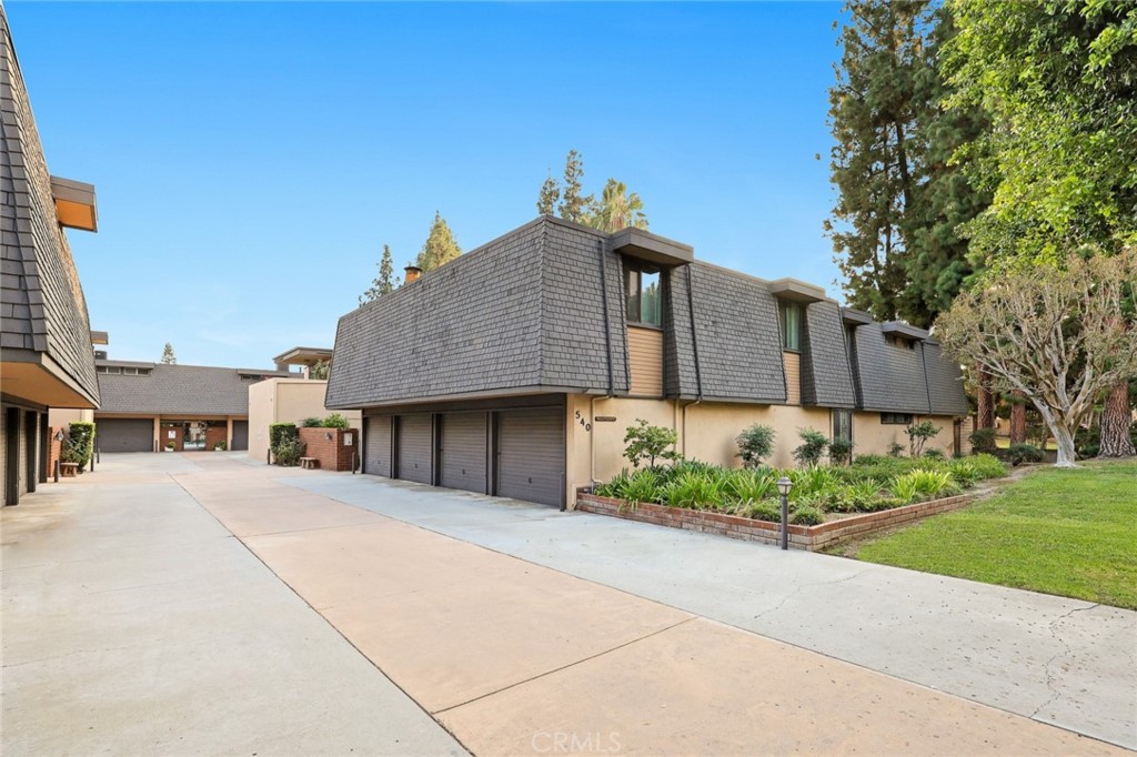 540 Fairview Avenue, Unit 27 Arcadia, CA 91007 - Photo 2 of 40 a front view of a house with a yard and potted plants