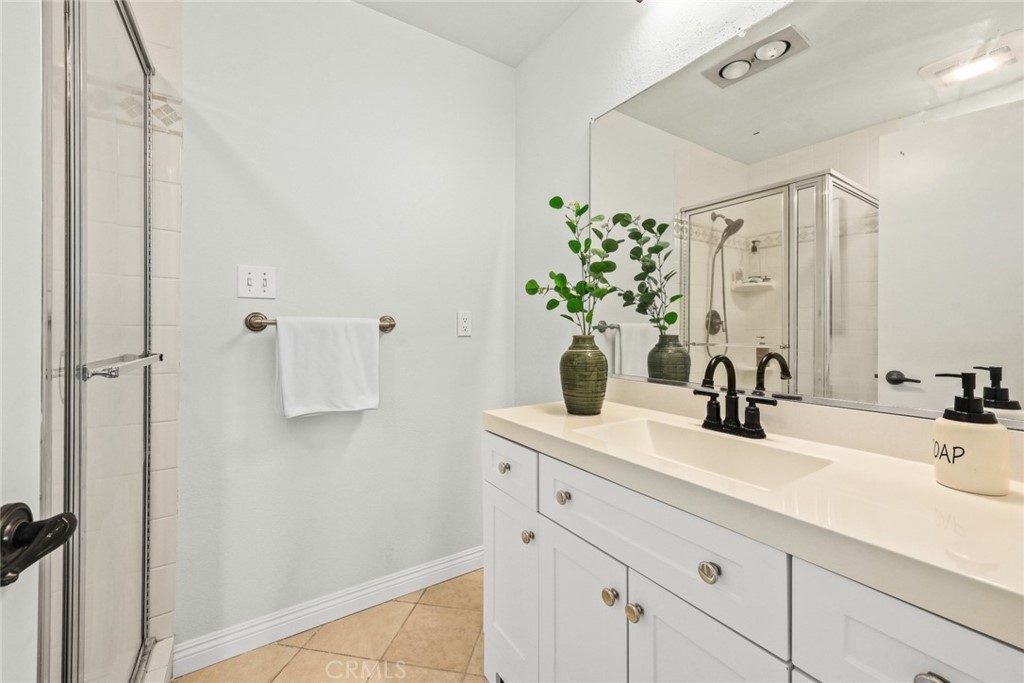 540 Fairview Avenue, Unit 27 Arcadia, CA 91007 - Photo 21 of 40 a bathroom with a sink vanity granite and a mirror