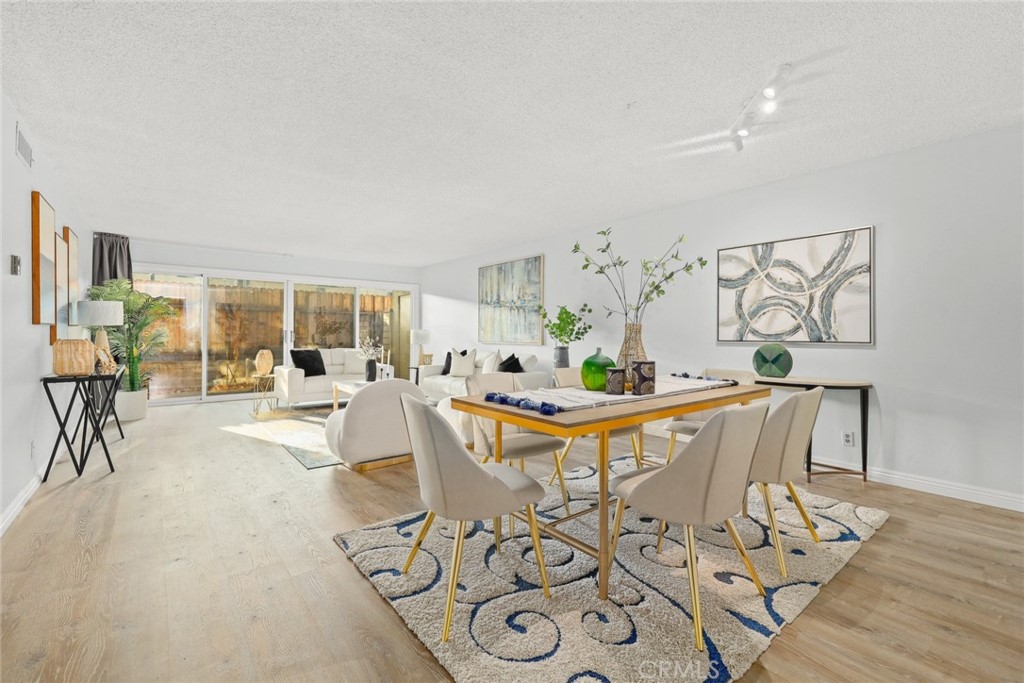 540 Fairview Avenue, Unit 27 Arcadia, CA 91007 - Photo 7 of 40 a view of a dining room with furniture and wooden floor