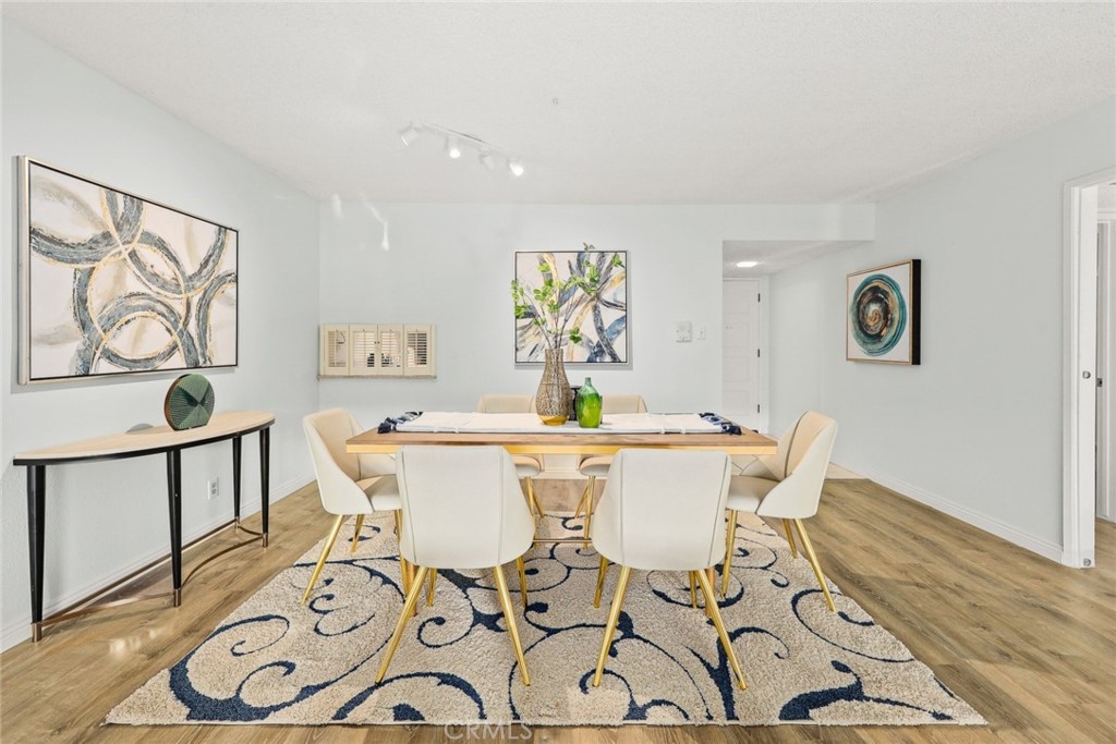 540 Fairview Avenue, Unit 27 Arcadia, CA 91007 - Photo 8 of 40 a view of a dining room with furniture and wooden floor