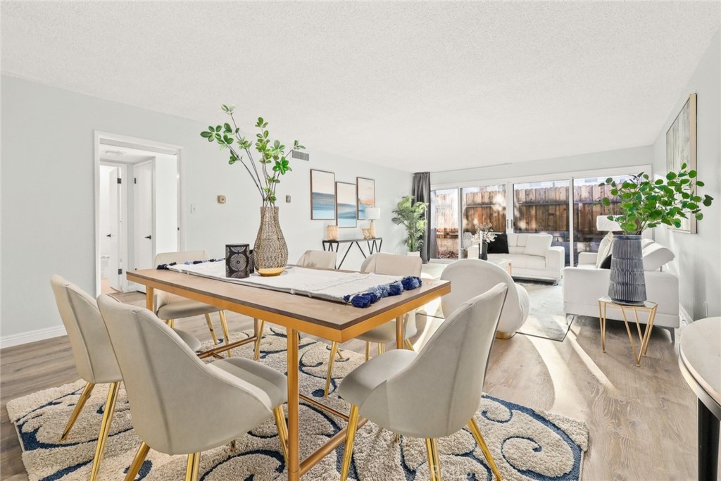 540 Fairview Avenue, Unit 27 Arcadia, CA 91007 - Photo 9 of 40 a living room with furniture a potted plant and open kitchen view