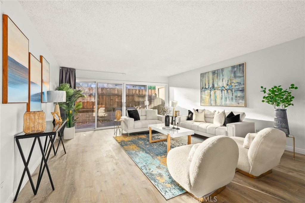 540 Fairview Avenue, Unit 27 Arcadia, CA 91007 - Photo 10 of 40 a living room with furniture large window and potted plants