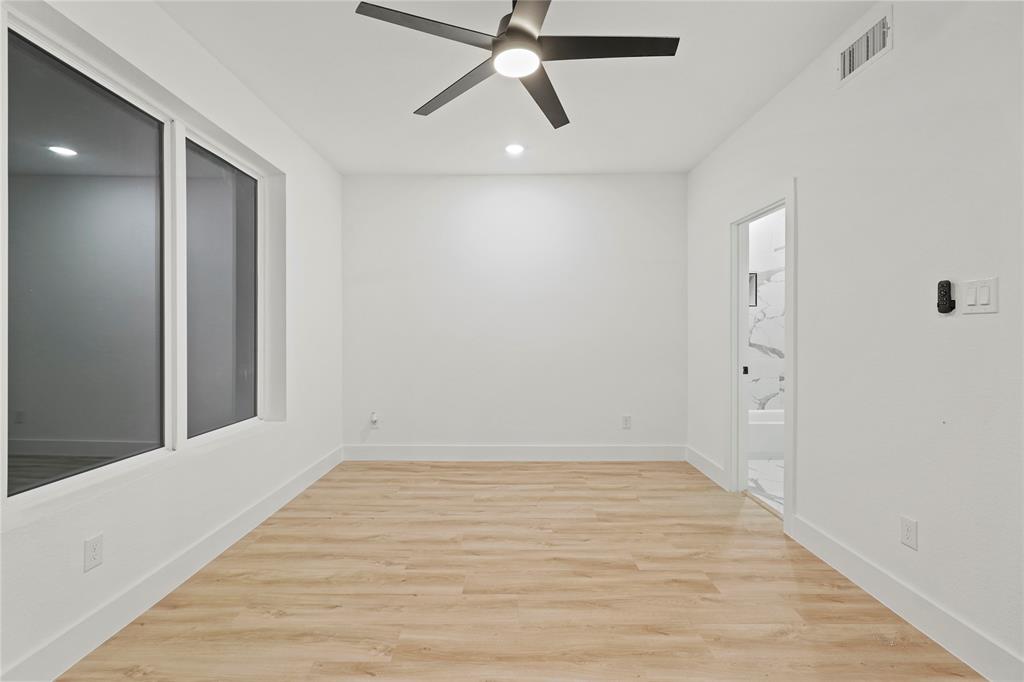 923 Walkway Street Dallas, TX 75212 - Photo 24 of 33 Spare room with light wood-style flooring, a ceiling fan, and recessed lighting