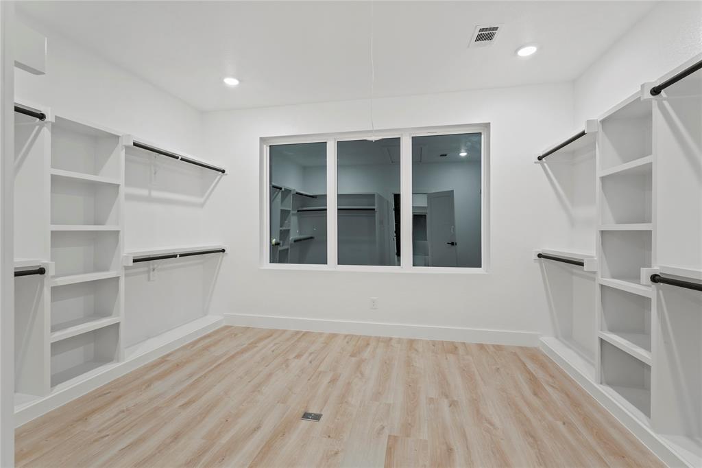 923 Walkway Street Dallas, TX 75212 - Photo 29 of 33 Spacious closet featuring light wood-style floors