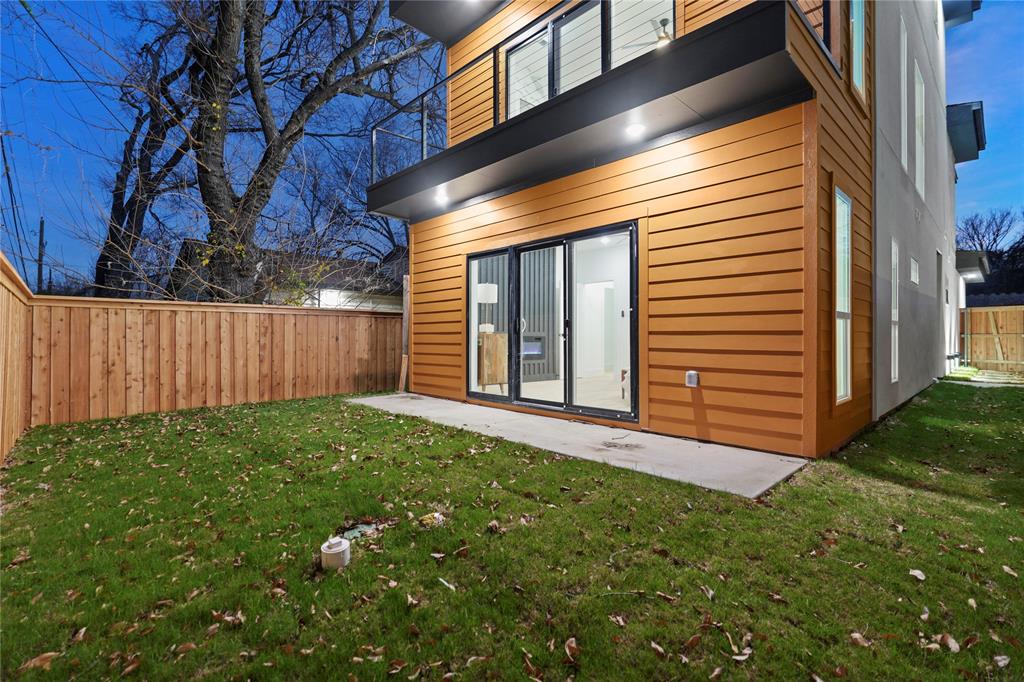 923 Walkway Street Dallas, TX 75212 - Photo 32 of 33 Back of property with a fenced backyard and a patio area