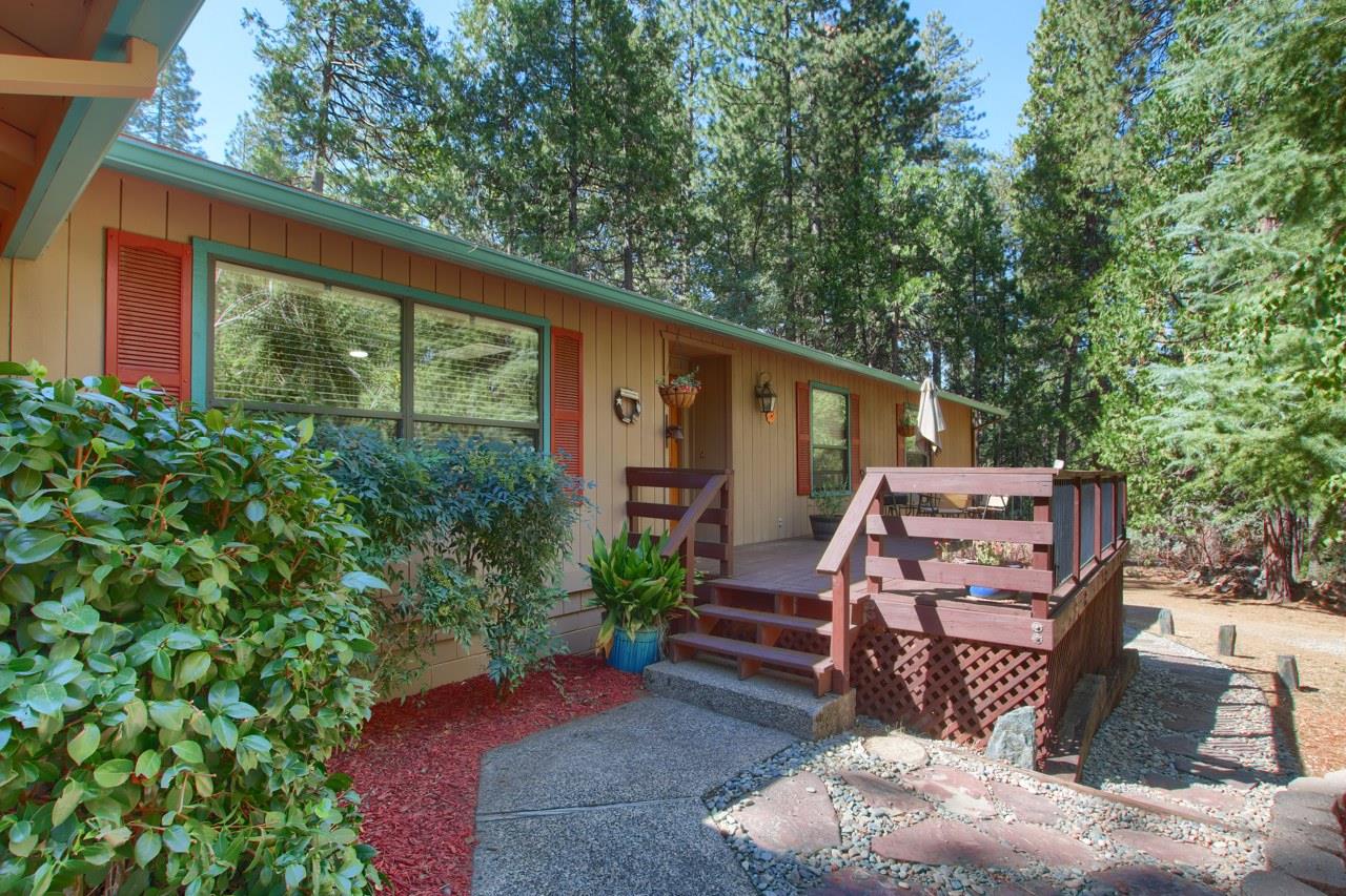 36555 Mudge Ranch Road Coarsegold, CA 93614 - Photo 6 of 80 a view of a patio with wooden chairs