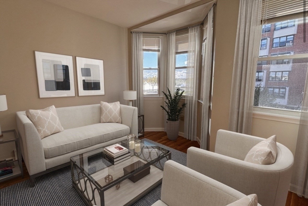 206 H Street, Unit 3 Boston, MA 02127 - Photo 4 of 8 a living room with furniture and a large window