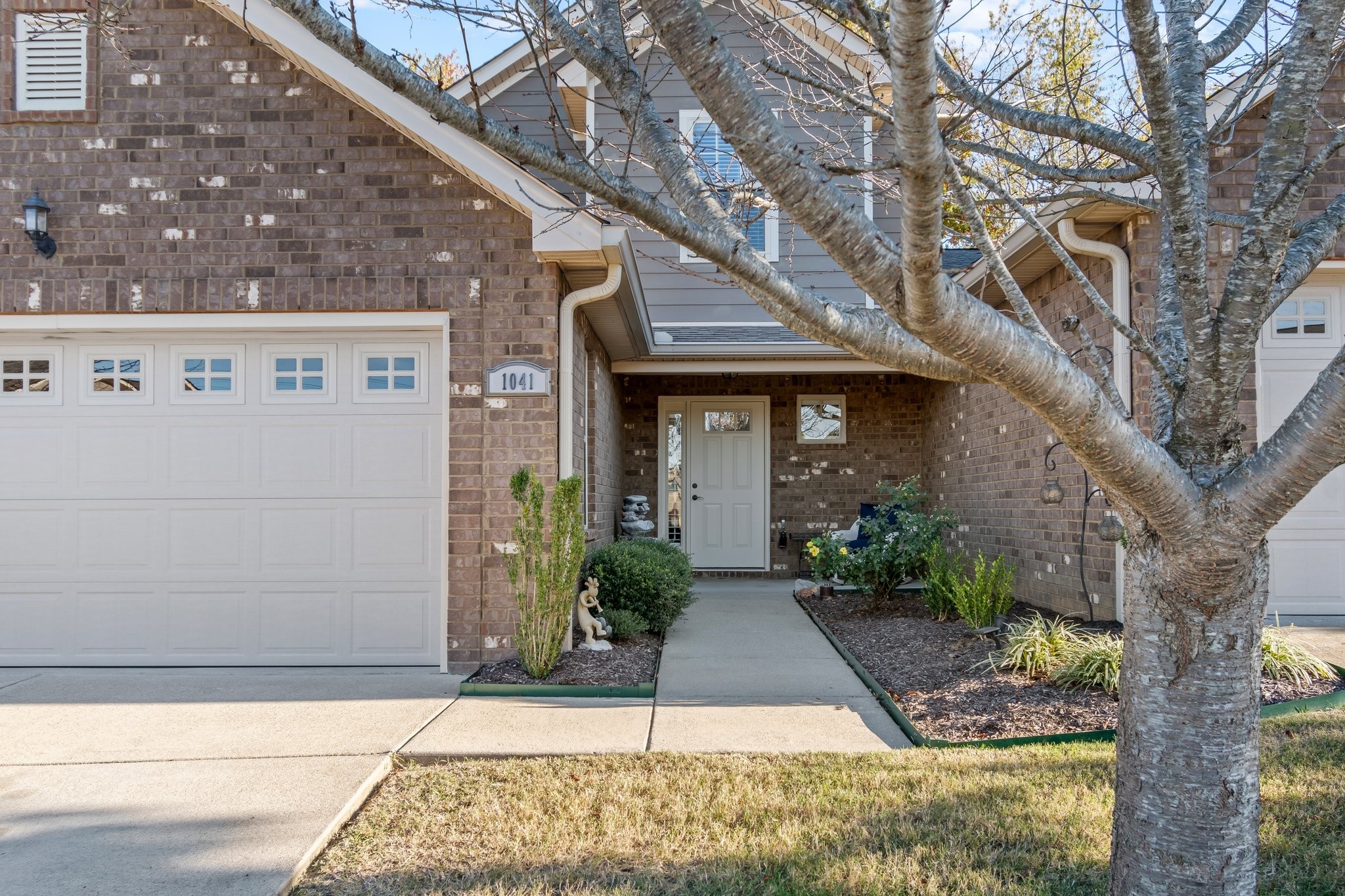 1041 Irish Way Spring Hill, TN 37174 - Photo 1 of 38 a front view of a house with garden