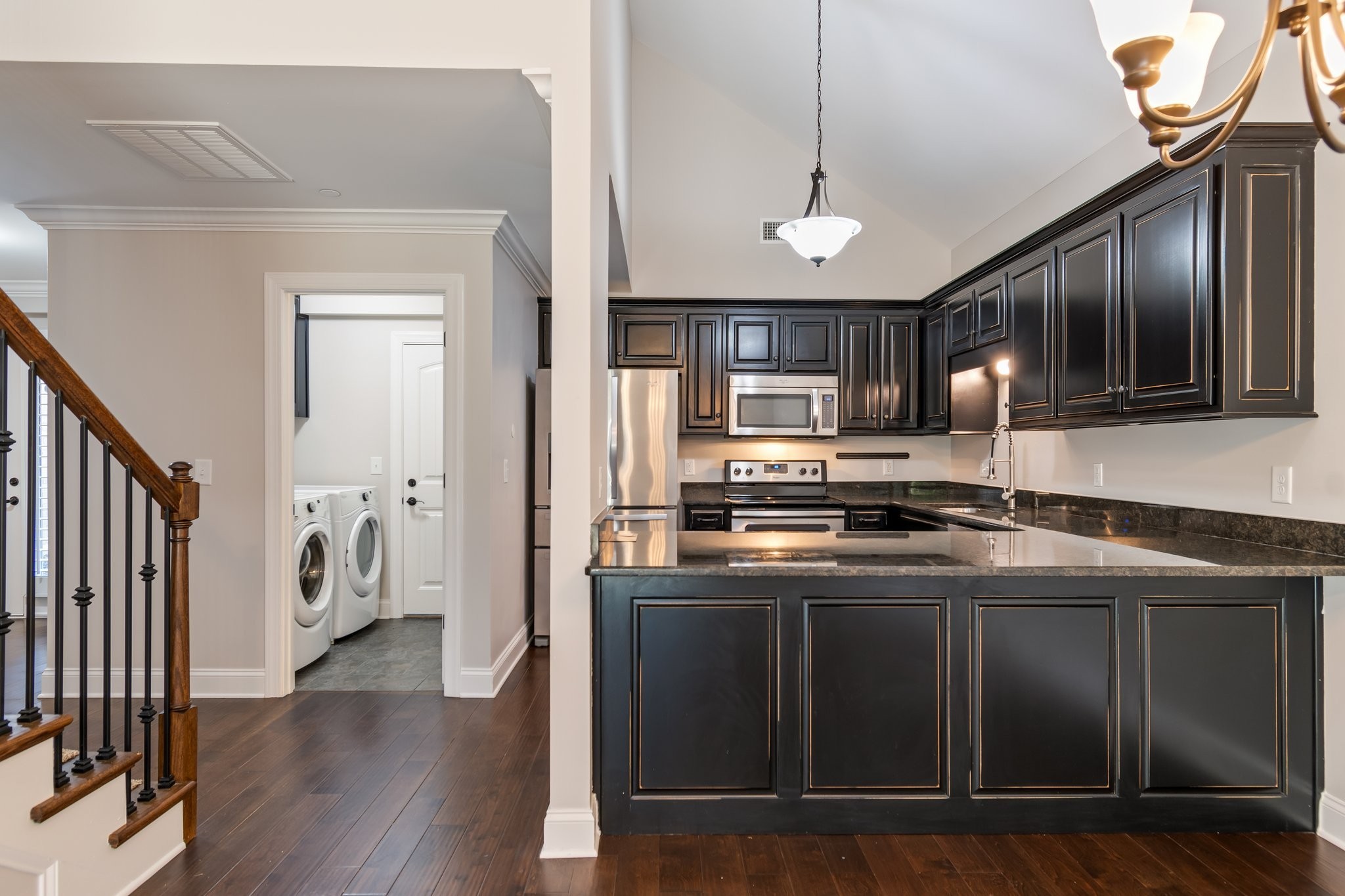1041 Irish Way Spring Hill, TN 37174 - Photo 13 of 38 a kitchen with stainless steel appliances granite countertop a sink a stove and a refrigerator