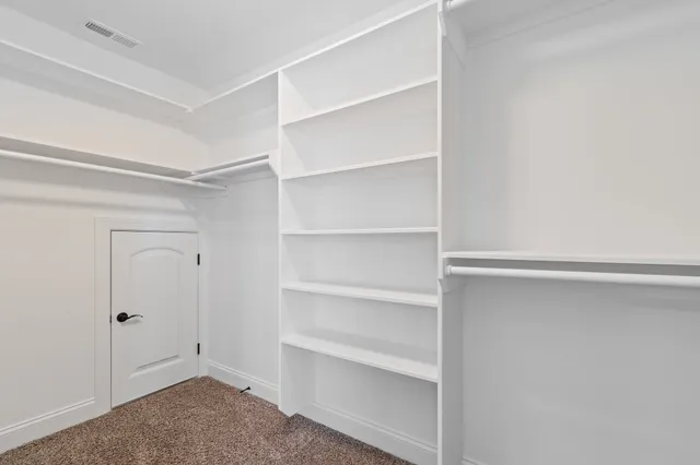 a view of an empty walk in closet